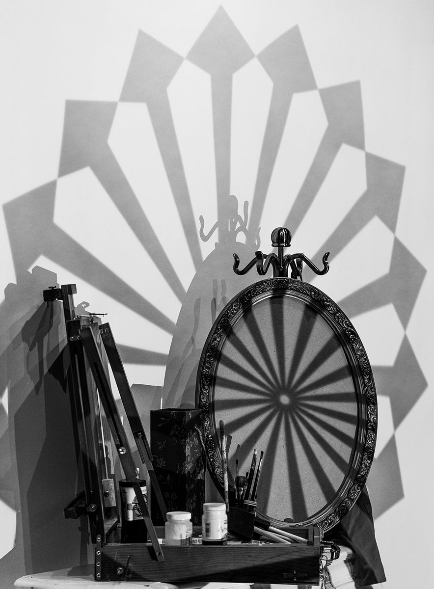 Creative photo that I captured and won Photo Follies, it is of art supplies and a shape projected on it.
