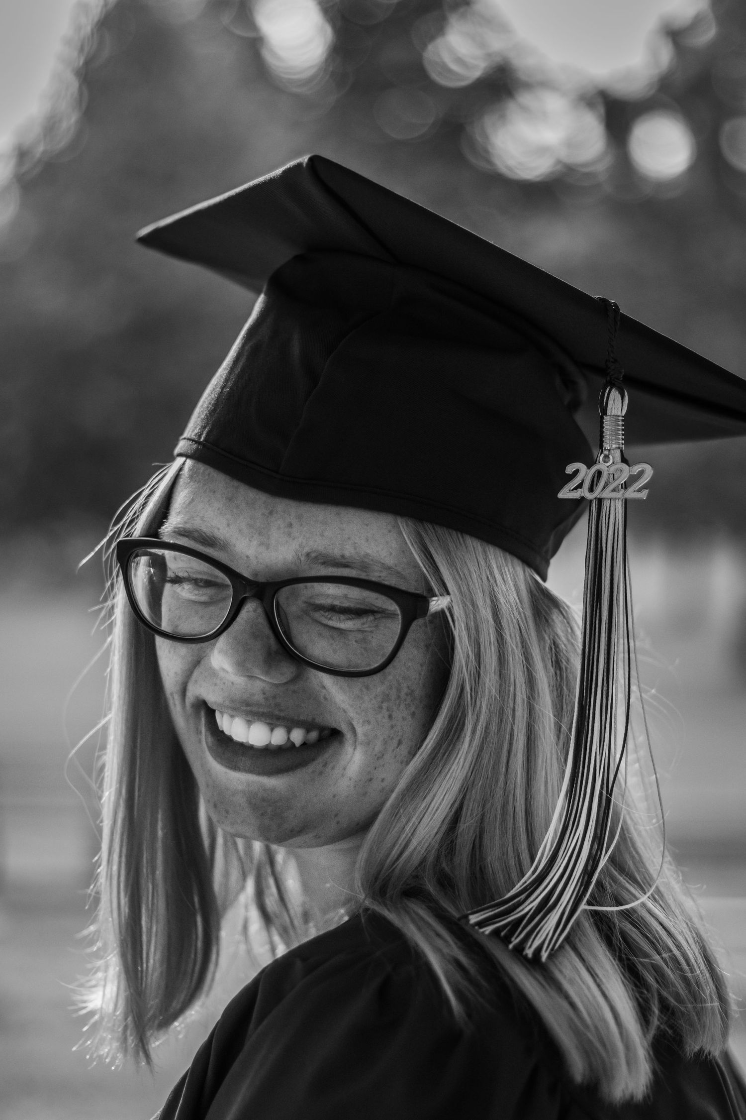 Female looking down for a senior photography session.