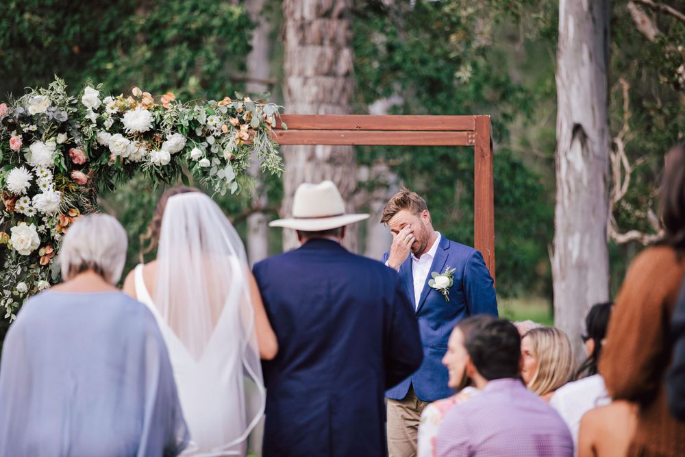 Groom crying at his beautiful bride entrance at Sunshine Coast wedding