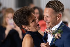 A touching mother-son dance moment during a wedding celebration.