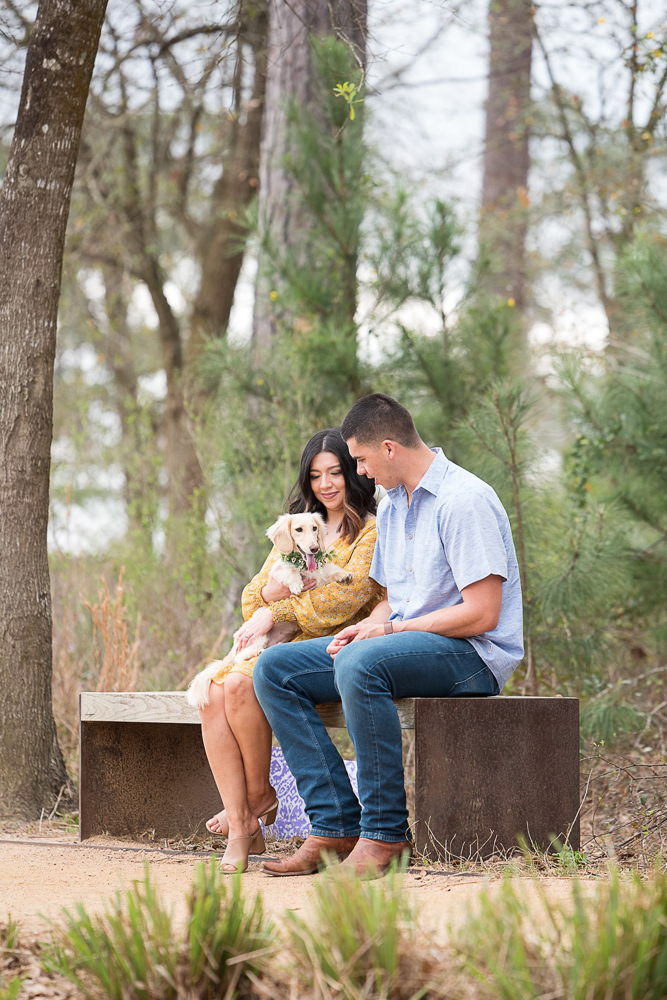couple posing with their dog at Houston Memorial Park