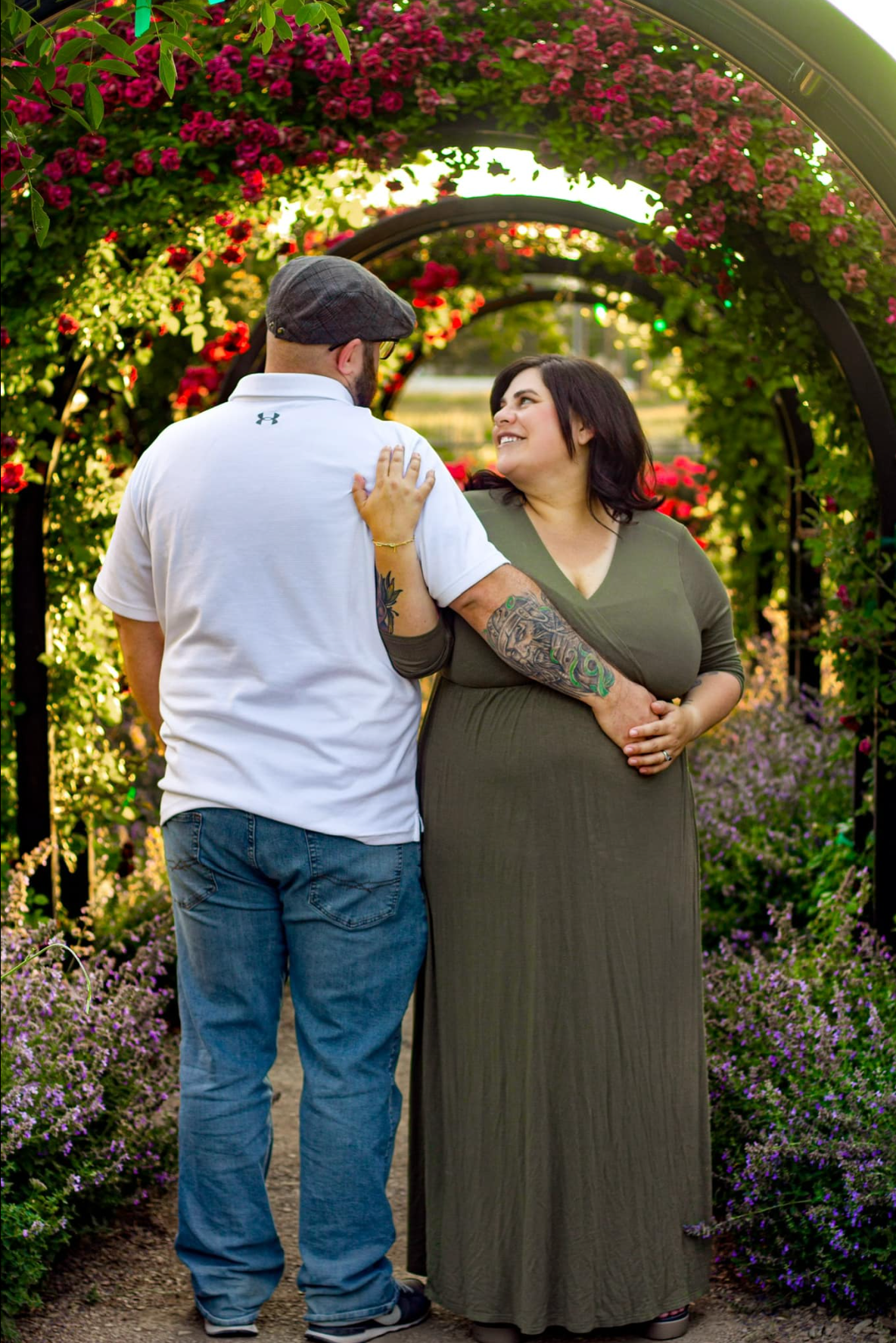 Husband and Wife posing for a maternity photoshoot at Wheeler Farm, Murray Ut.