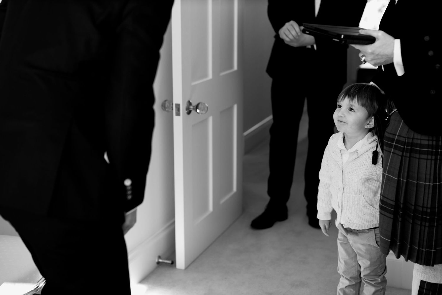 Candid moment during formal event preparations.