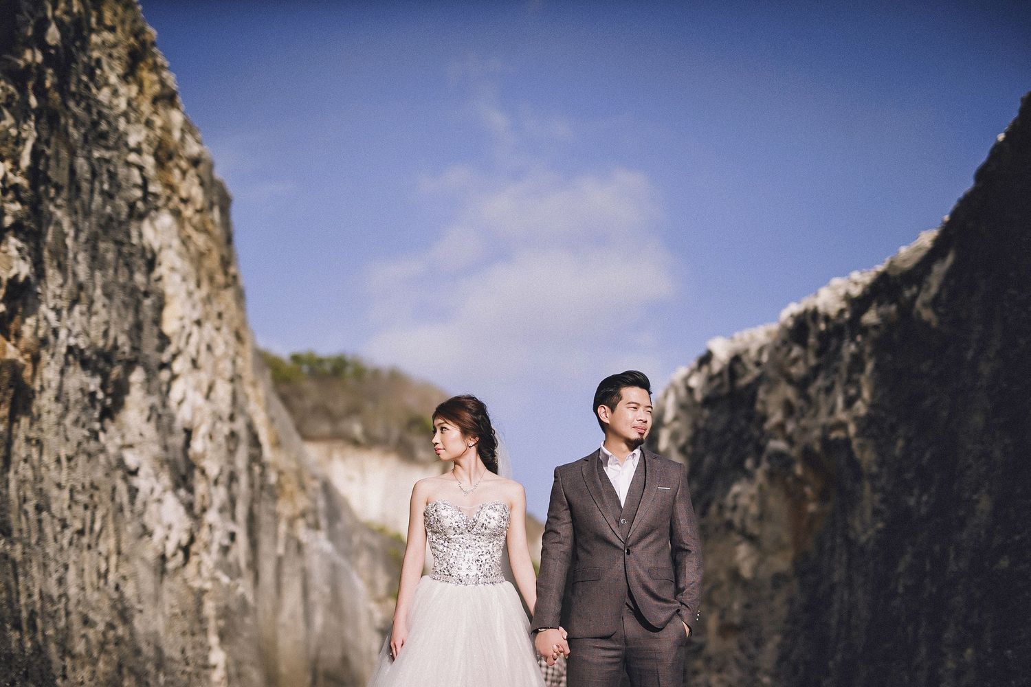 Elegant wedding photography in a dramatic mountain canyon landscape.