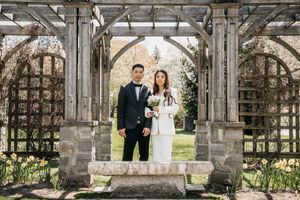 Groom and Bride beneath an arch