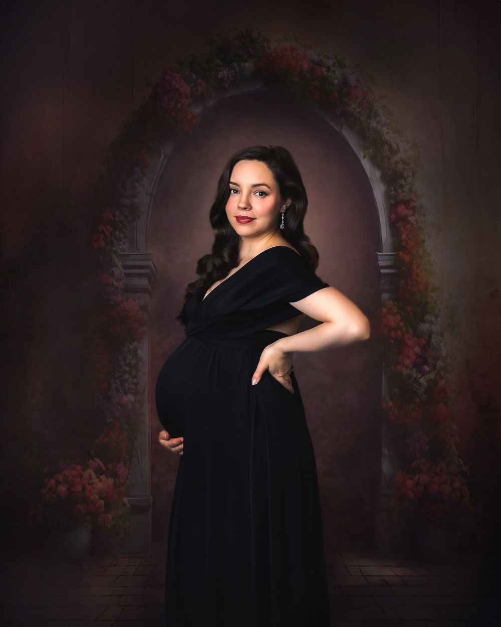 Elegant maternity portrait of a woman in a black dress posing in a vintage-inspired setting. Toronto maternity photography.