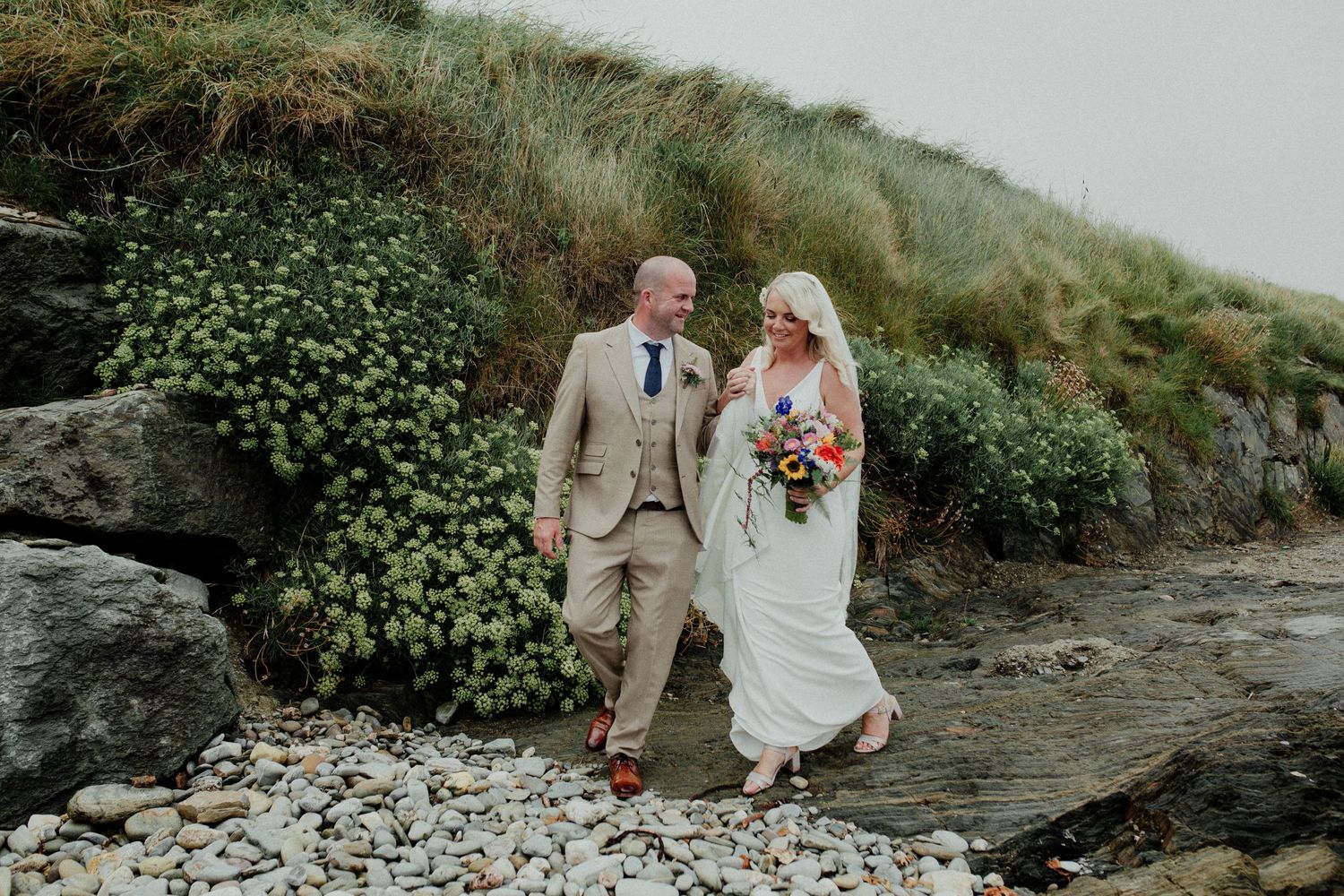 newly wed couple on the beach at Dunmore House in West Cork