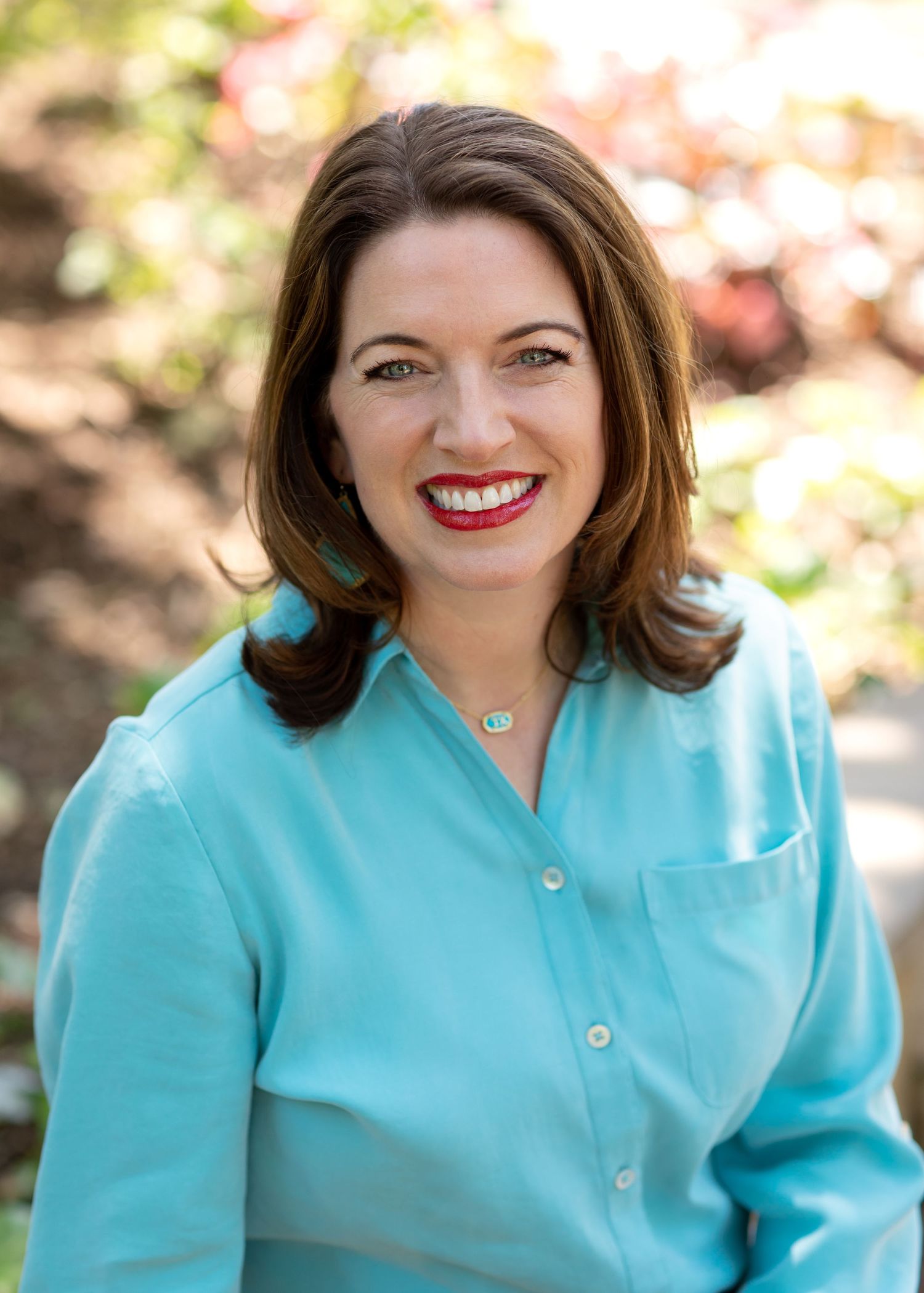 Professional headshots showing person in turquoise blazer against blurred background.