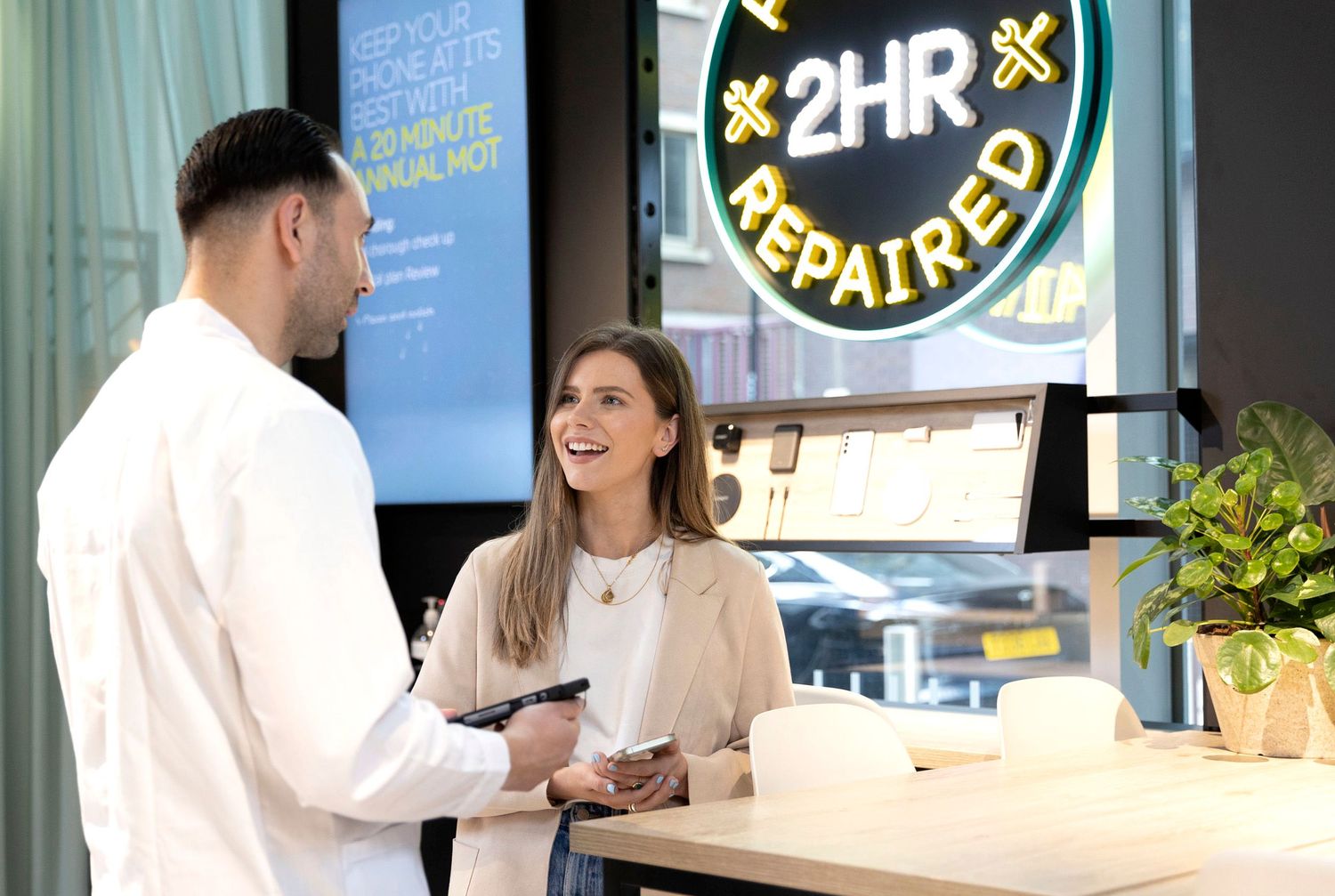 Commercial PR photo of a happy customer at an EE store