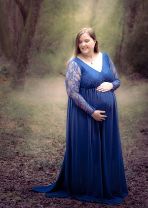 Elegant Maternity with God Rays in Blue Dress