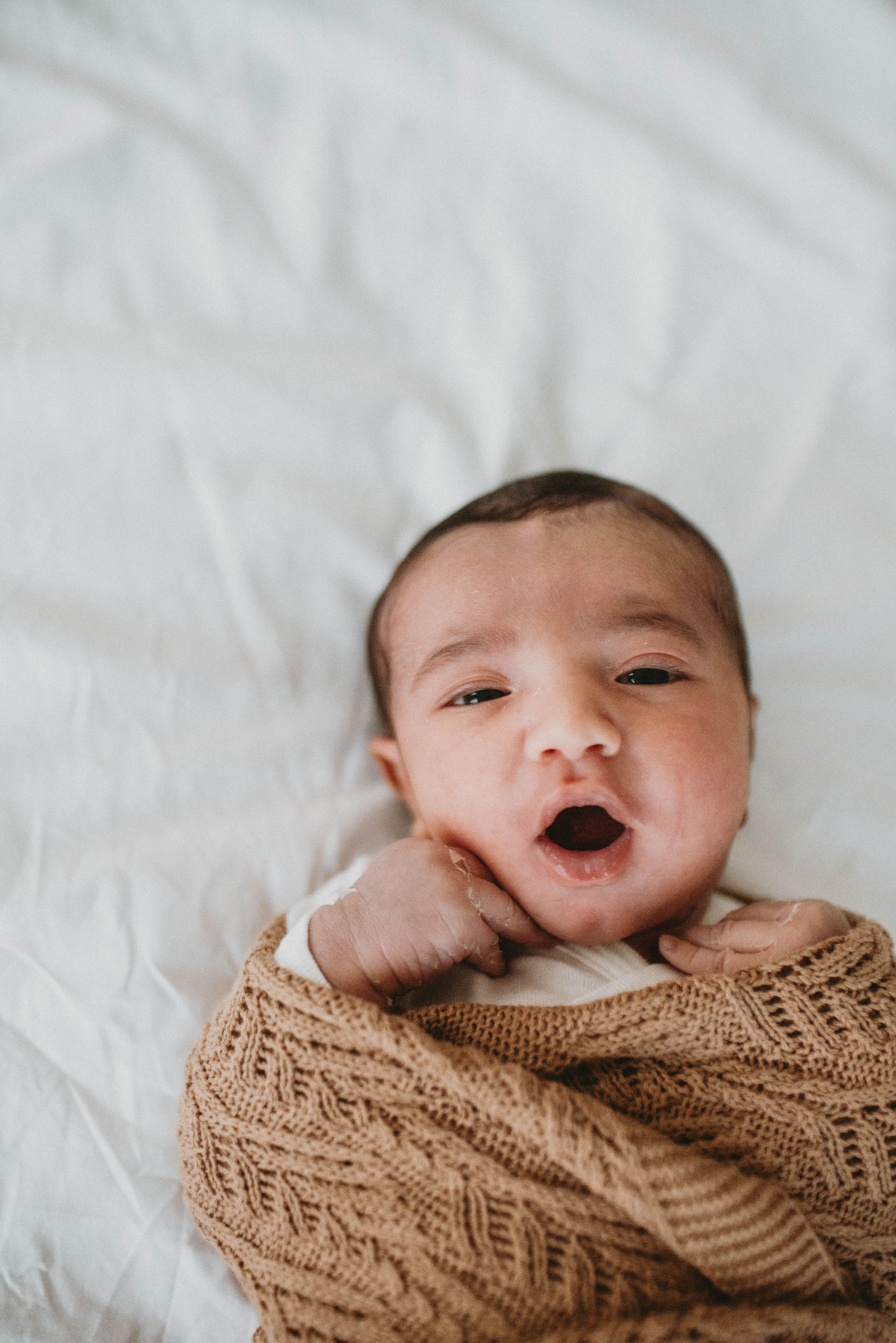 Close-up of a newborn baby’s face in Sydney & Northern Beaches, capturing delicate features and precious, fleeting moments.