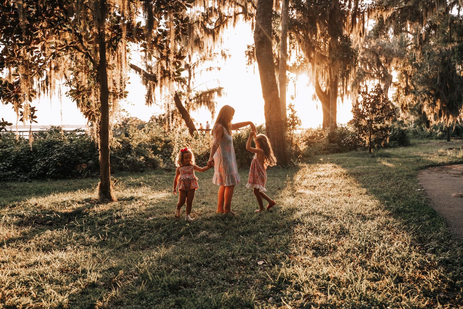 Mother Twirling daughters in the golden hour in Jacksonville, Florida