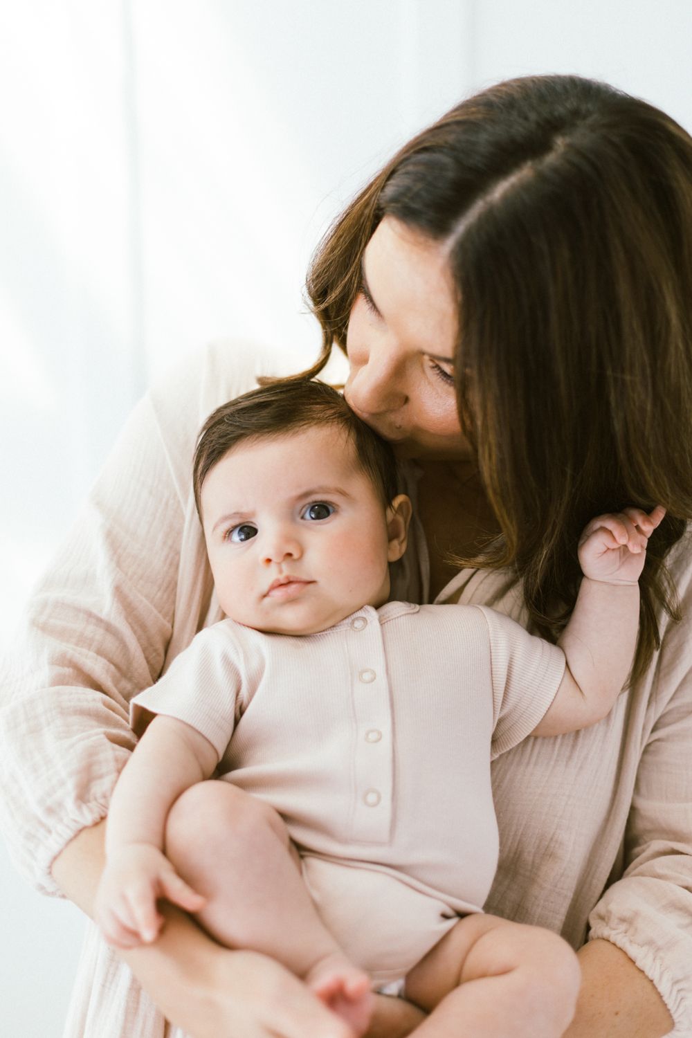 A series of intimate portrait moments in soft, natural lighting.