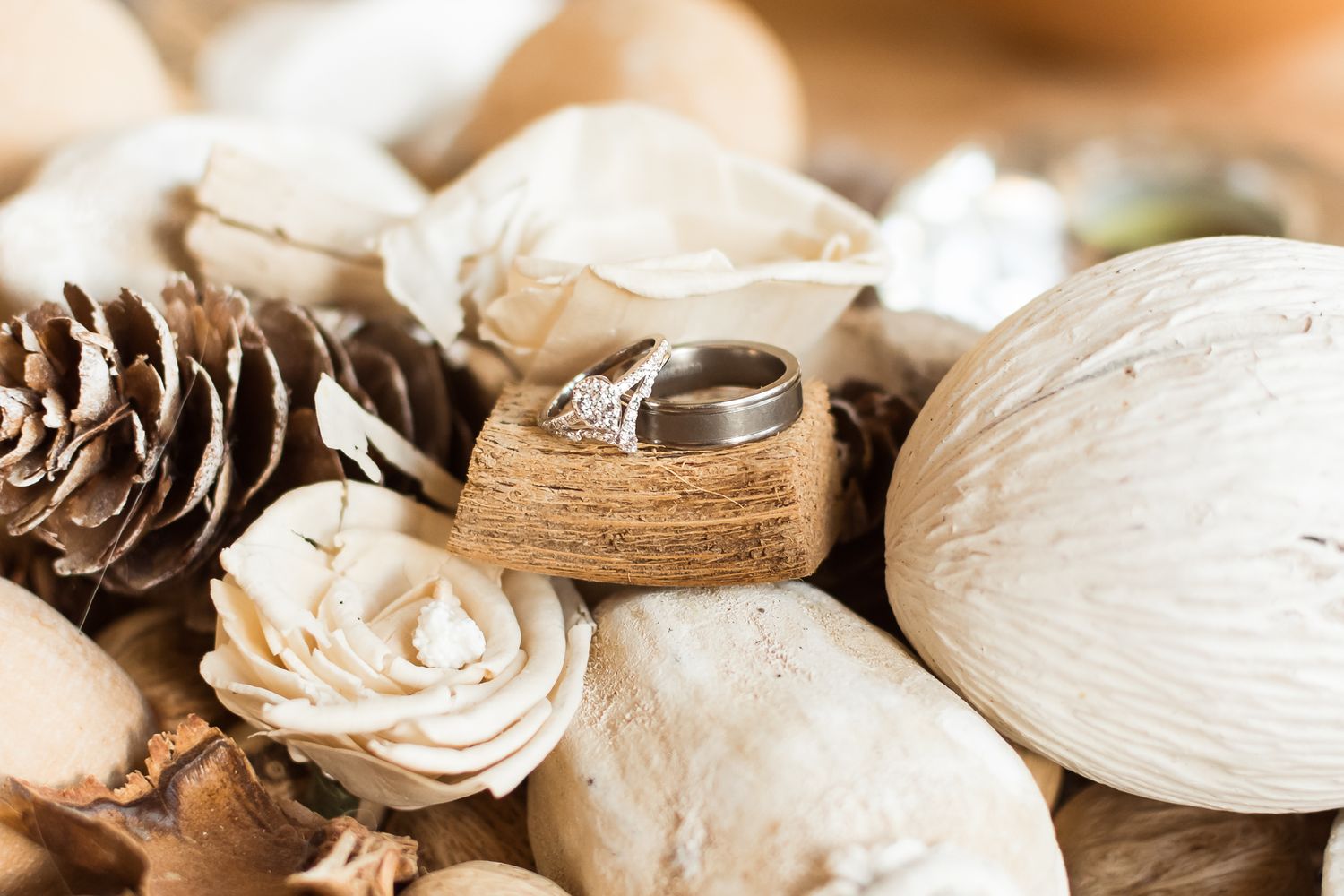 Wedding rings with neutral dried florals. Photo taken in Vancouver by Kari Mills Photography.