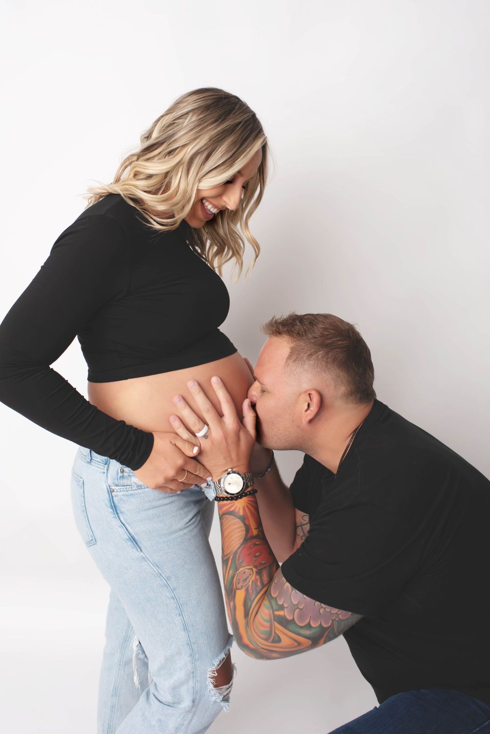 casual lifestyle studio maternity belly kiss mom and dad