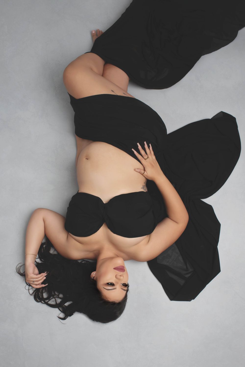 sexy elegant lying down maternity photo