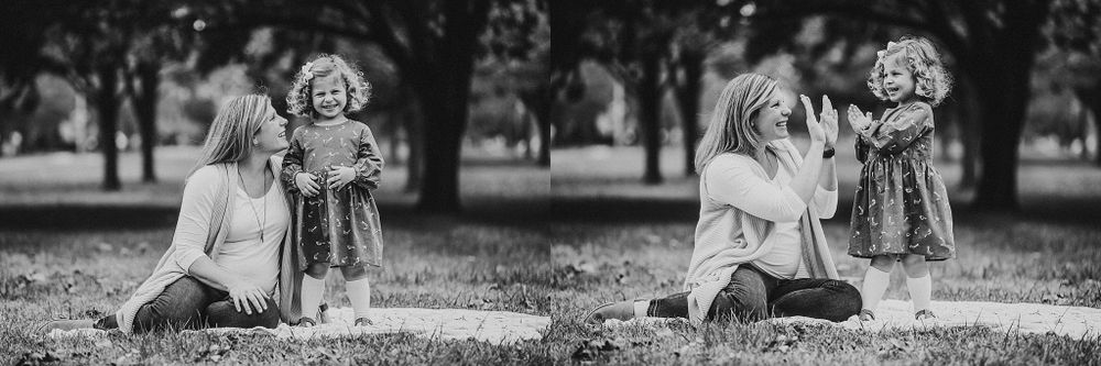 Black and white images showing tender interactions during a family photo session in a park.