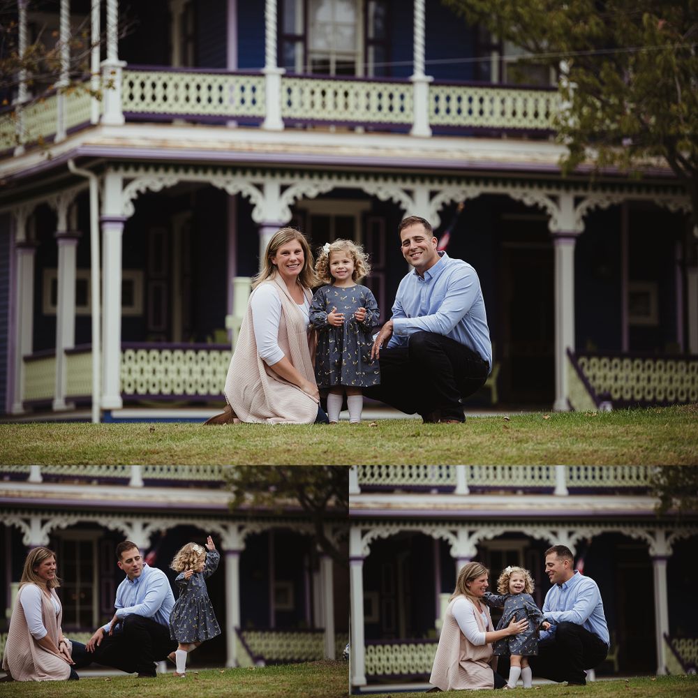 Family portrait session in front of a beautiful Victorian home with ornate white trim and balconies.