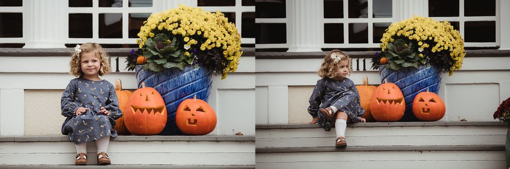 Fall decorative scene with pumpkins and yellow mums flanking a child in a patterned dress.