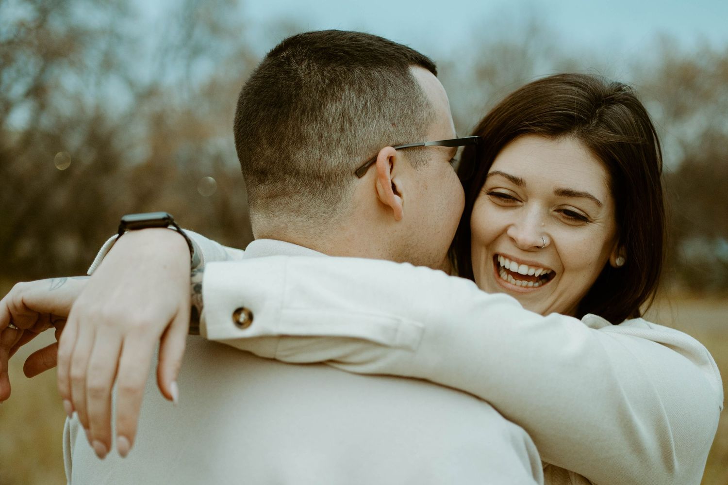 Joyful moment captured during outdoor engagement photoshoot in natural lighting in Edmonton, Alberta.