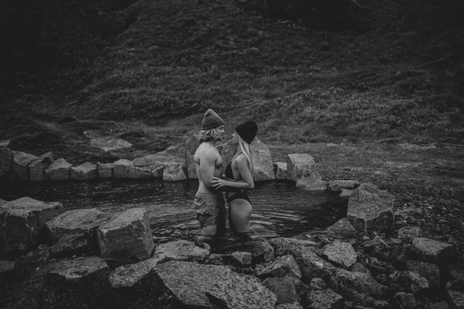 A black and white photograph of an intimate moment by natural springs in Iceland.