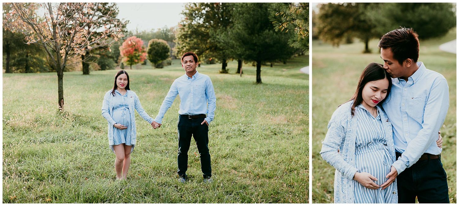 man and pregnant woman holding hands standing in grassy field