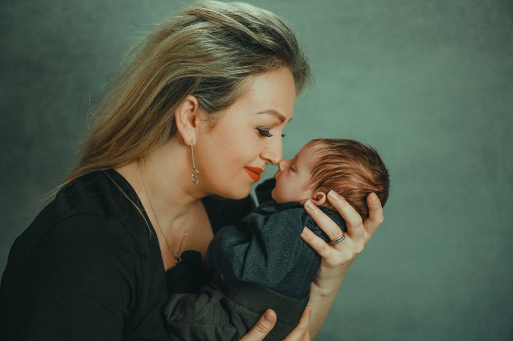 An intimate photo sequence capturing tender moments between two people against a green background.