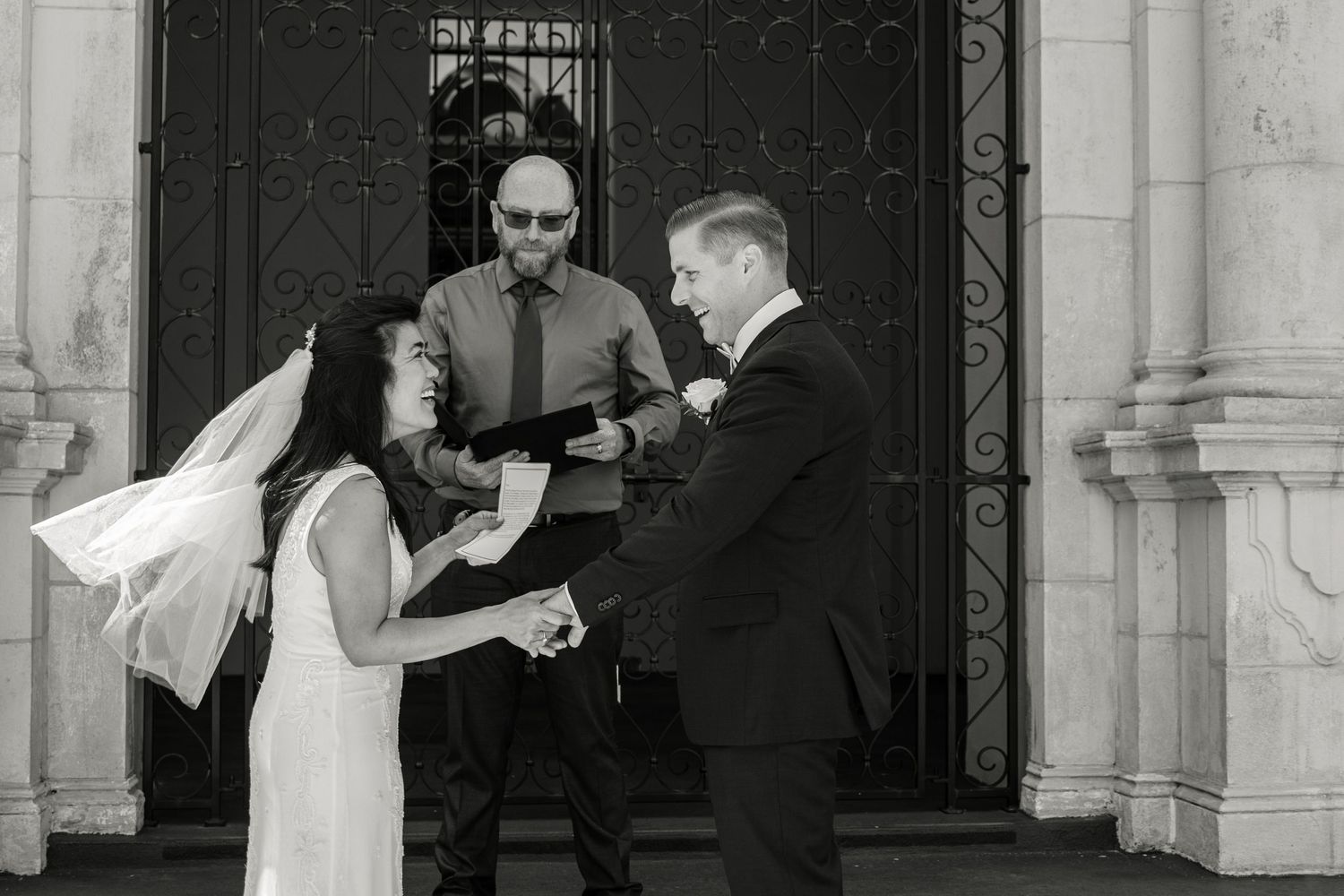 All brides having an outdoor wedding ceremony should purchase veil weights. By Saint Petersburg FL wedding photographers