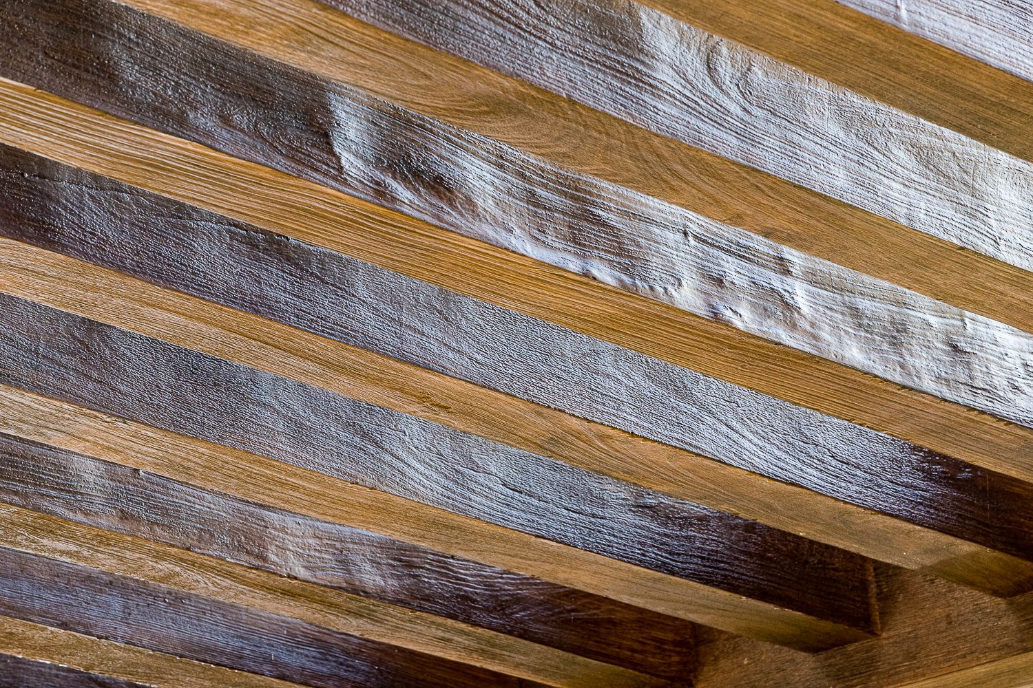 Unique Lighting of Wood underside of a train bridge