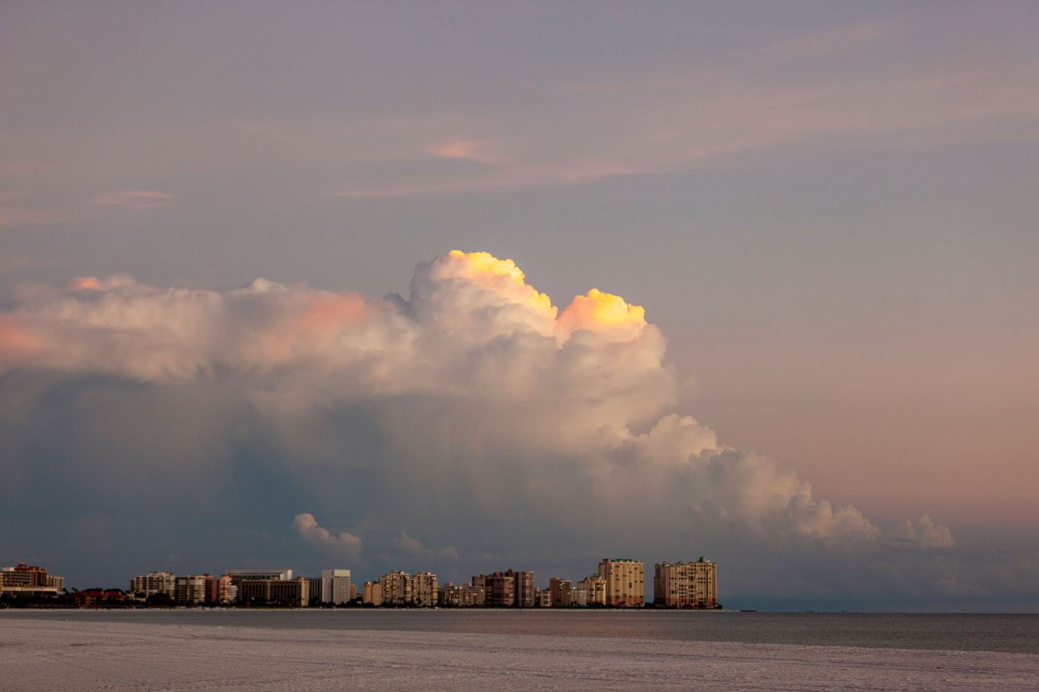Marco Island beach and skyline with massive thunderhead clouds looming before a storm in Florida