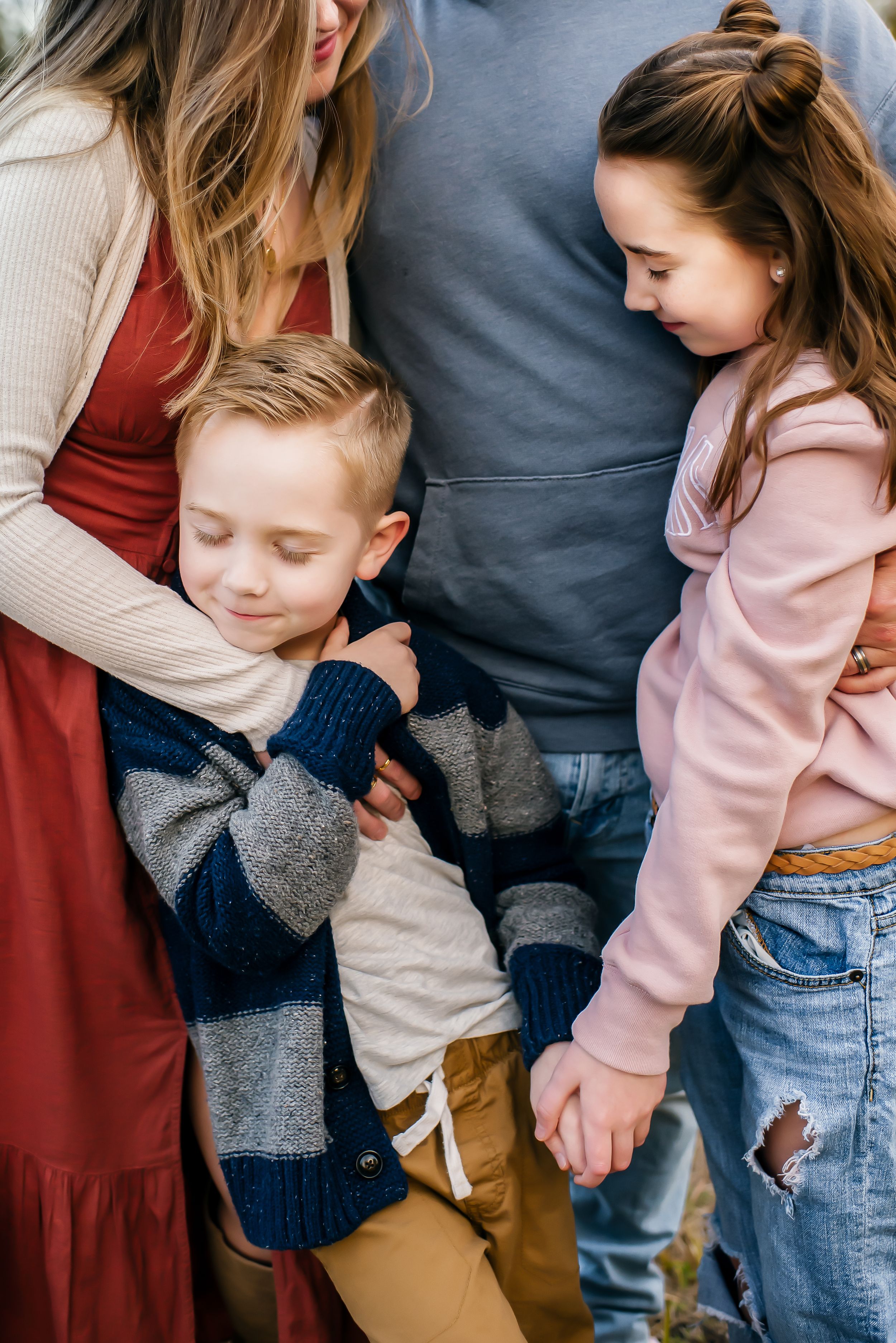 A son and daughter cuddling during a family photographing session in Orlando, FL.