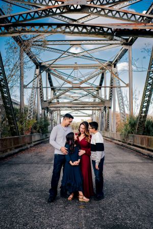 A family session on an iron bridge in Sanford, FL.