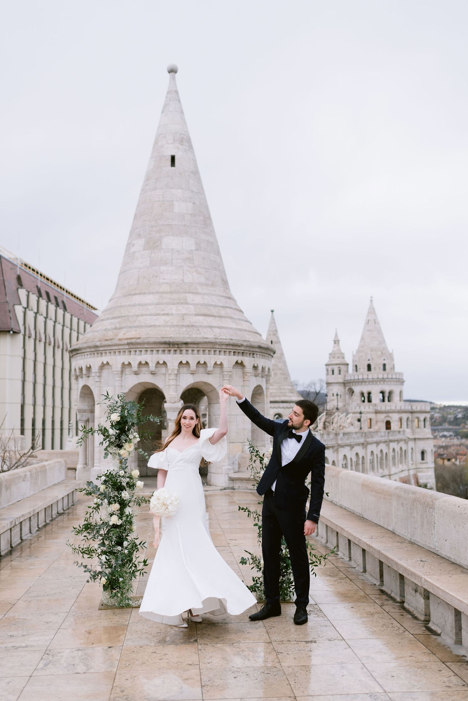 bride-and-groom-with-budapest-city-view-at-fishermans-bastion-destination-wedding-photo.jpg