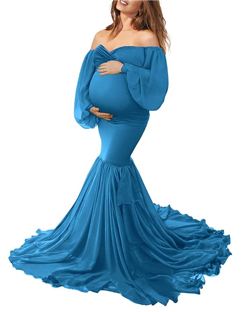 Flowing blue off-shoulder maternity gown with dramatic mermaid silhouette and long train.