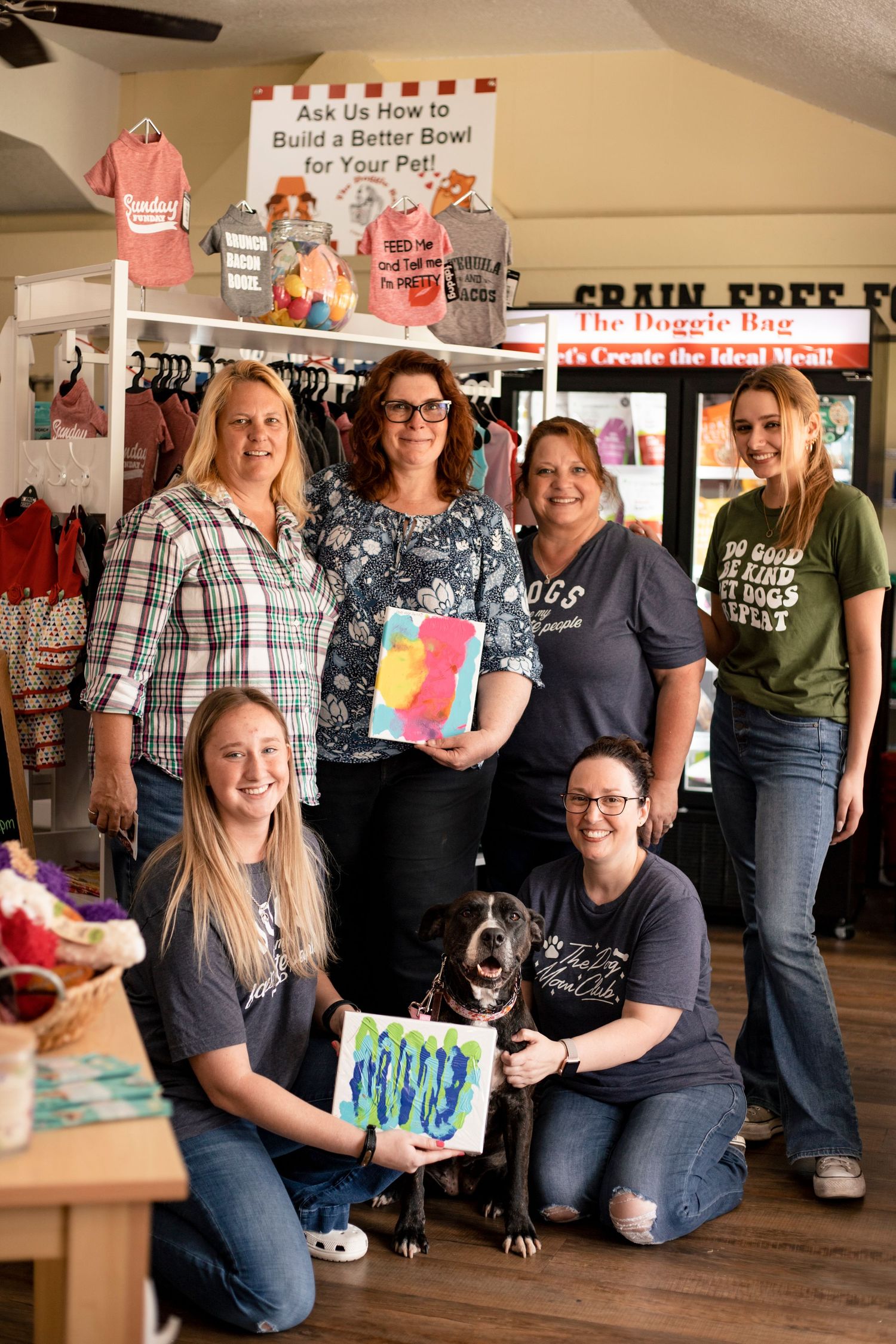 Dog boutique team posing for a photo