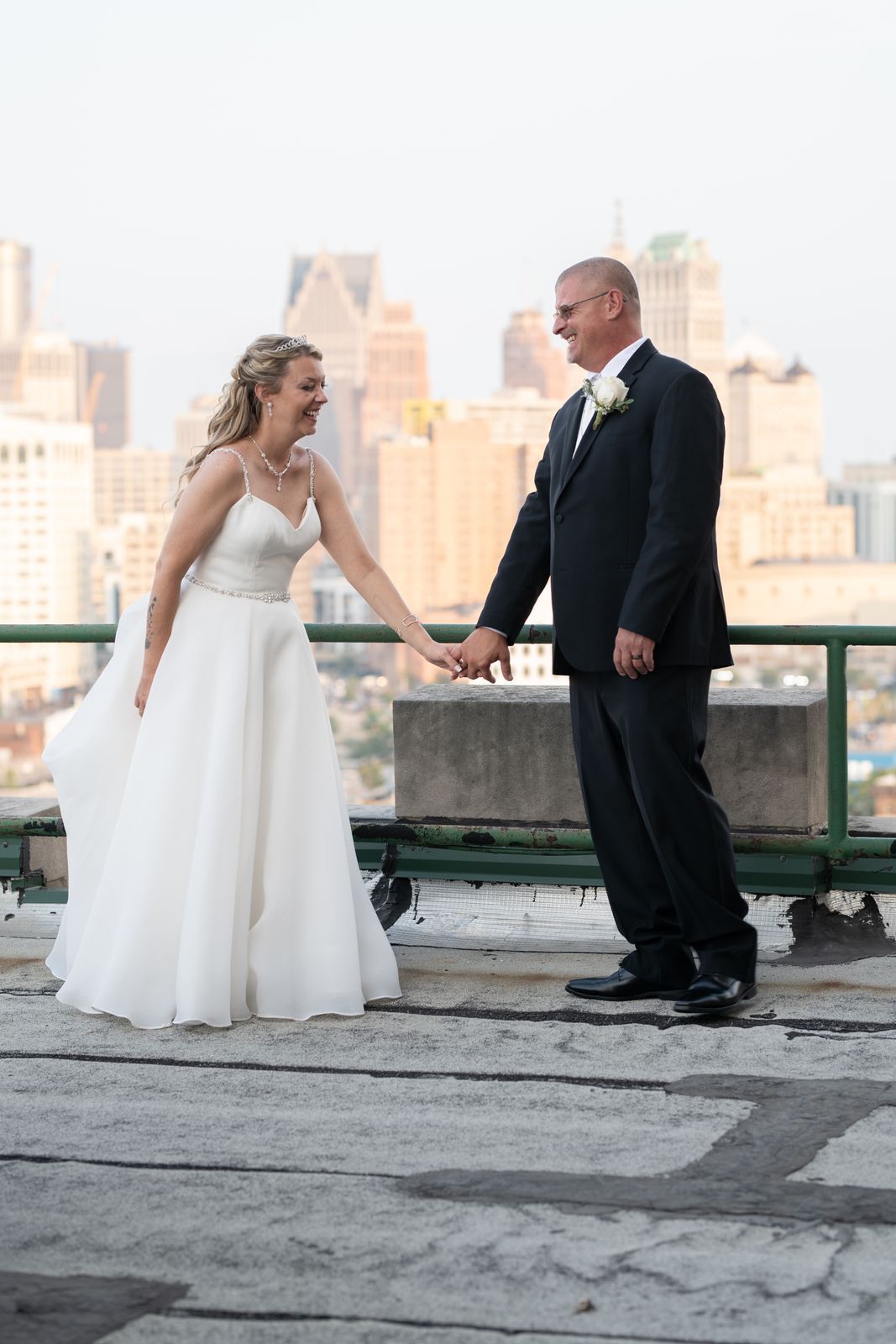 Couple laughing on a rooftop