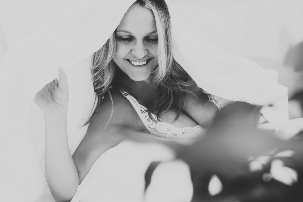 Black and white portrait capturing joyful candid moment.