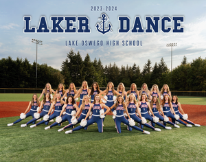 Lake Oswego High School dance team poses in blue uniforms on athletic field for 2023-2024 season photo.