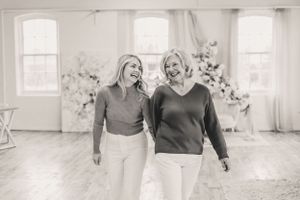 A black and white photo collage showing joyful candid moments between a woman and her elderly mother in a bright, airy indoor space.
