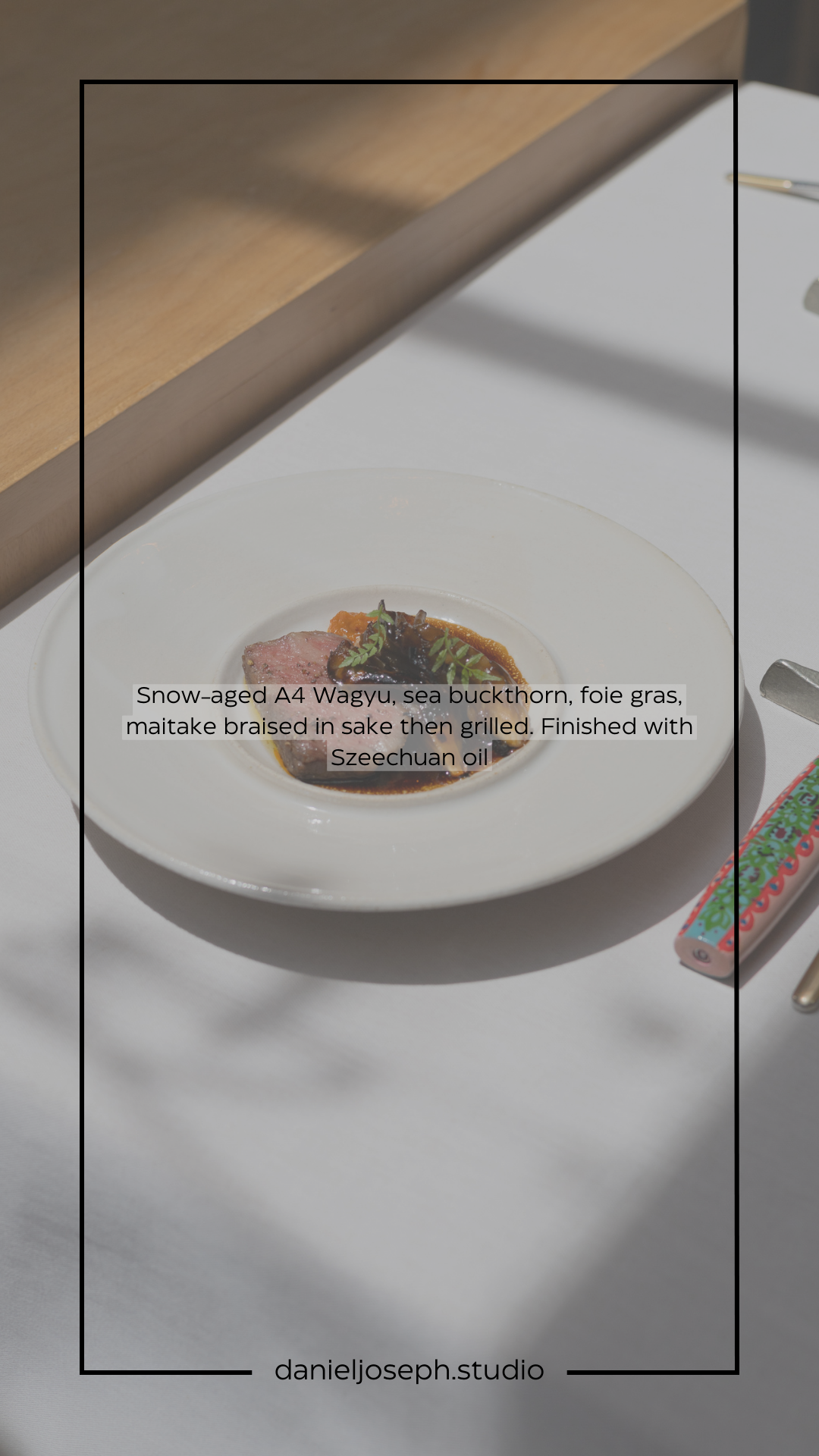 Artfully plated dish featuring wagyu beef and foie gras on white porcelain.
