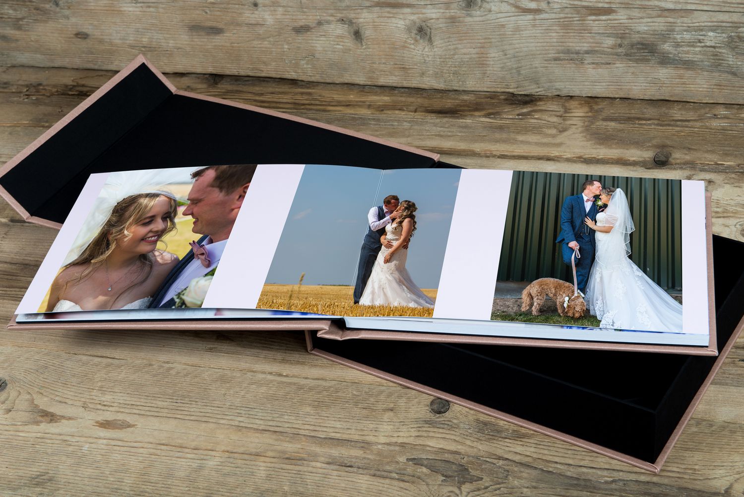 Wedding photo album spread displaying multiple romantic moments on wooden background.
