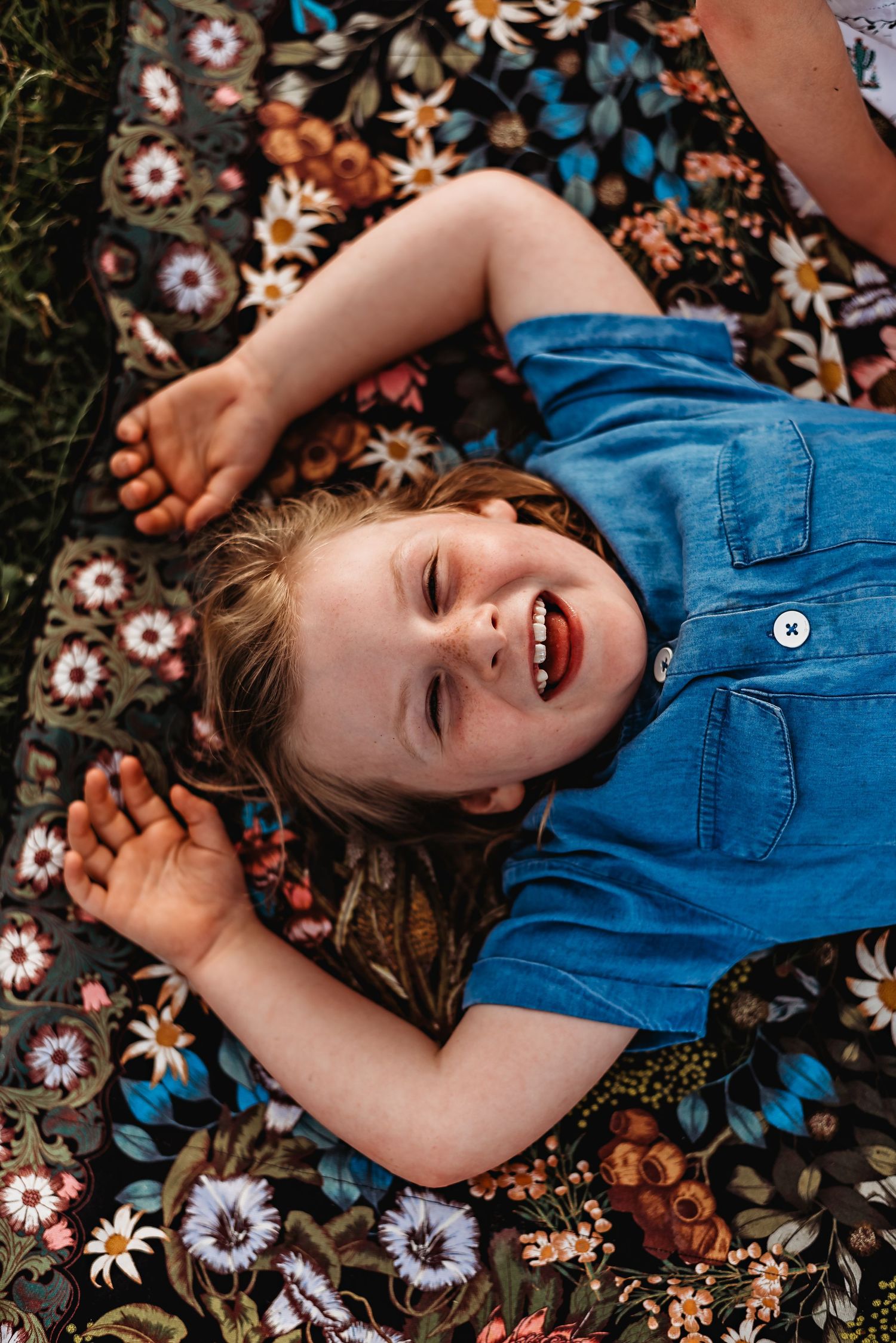 girl laughing taken during family session by tasmanian photographer joss jensen