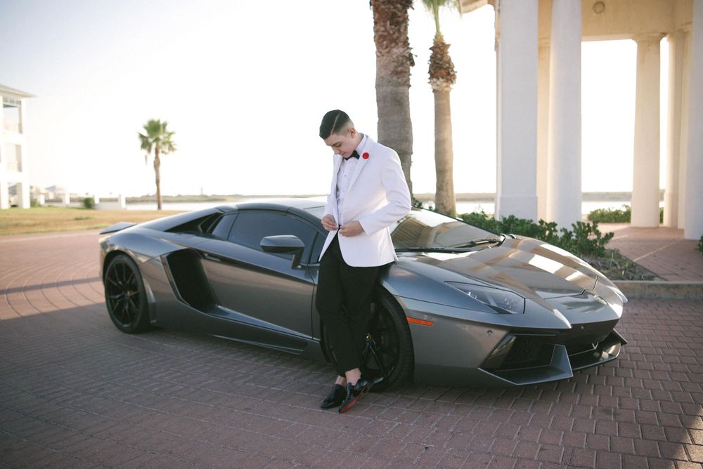 boy posing with a Lamborghini at his photo shoot. South padre island, texas