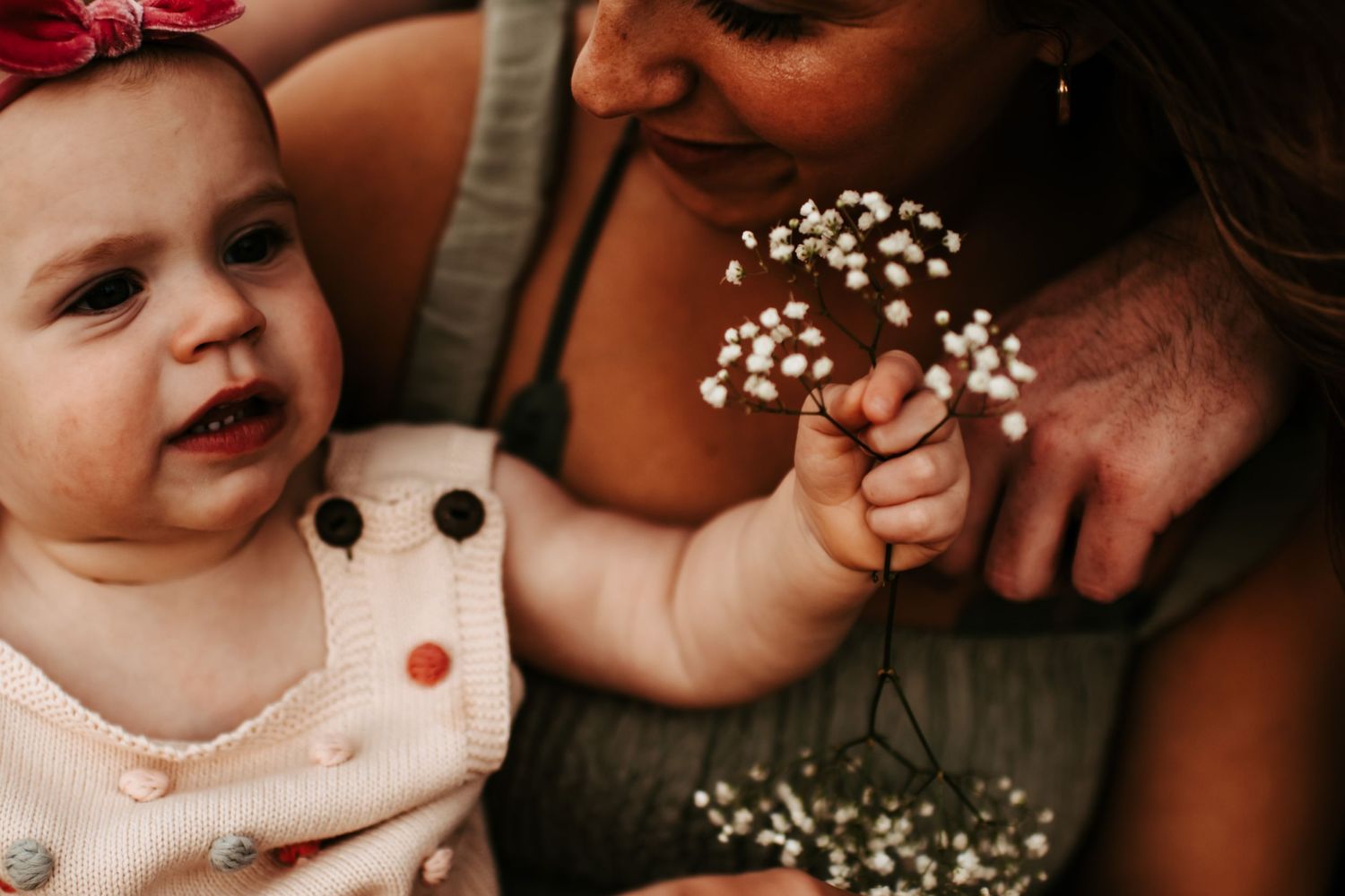 A tender moment with delicate baby's breath flowers captured in intimate detail.