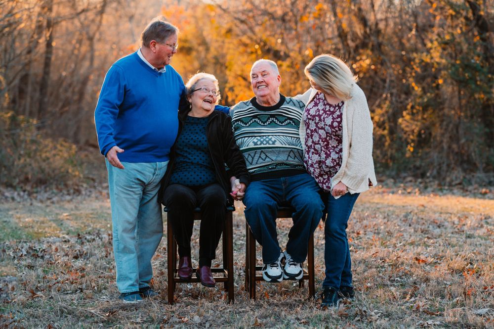 grandparents take photo with adult children during dallas area sunset extended family portrait session outdoors