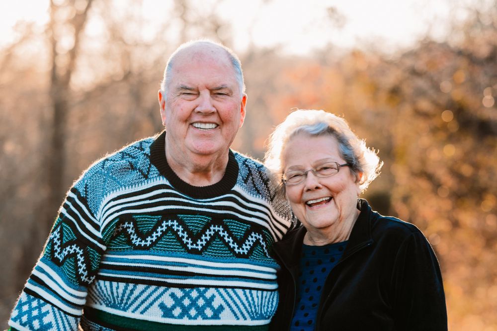 portrait of great grandparents smiling together at camera during dallas area extended family photo session