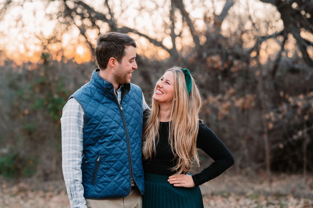 portrait of a couple looking at each other during dallas area sunset extended family portrait session outdoors