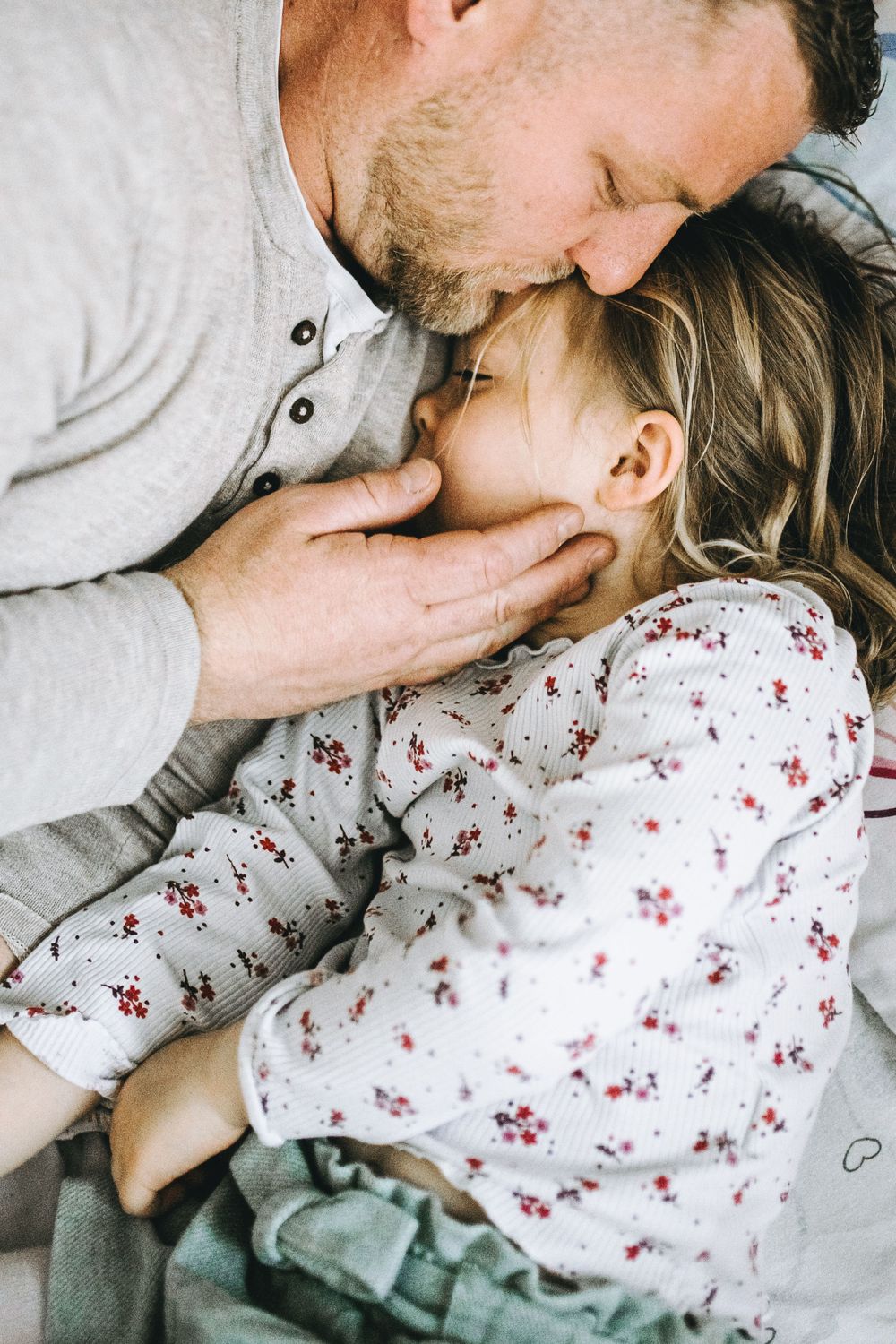 An intimate close-up of tender family moments captured in a series of gentle interactions.