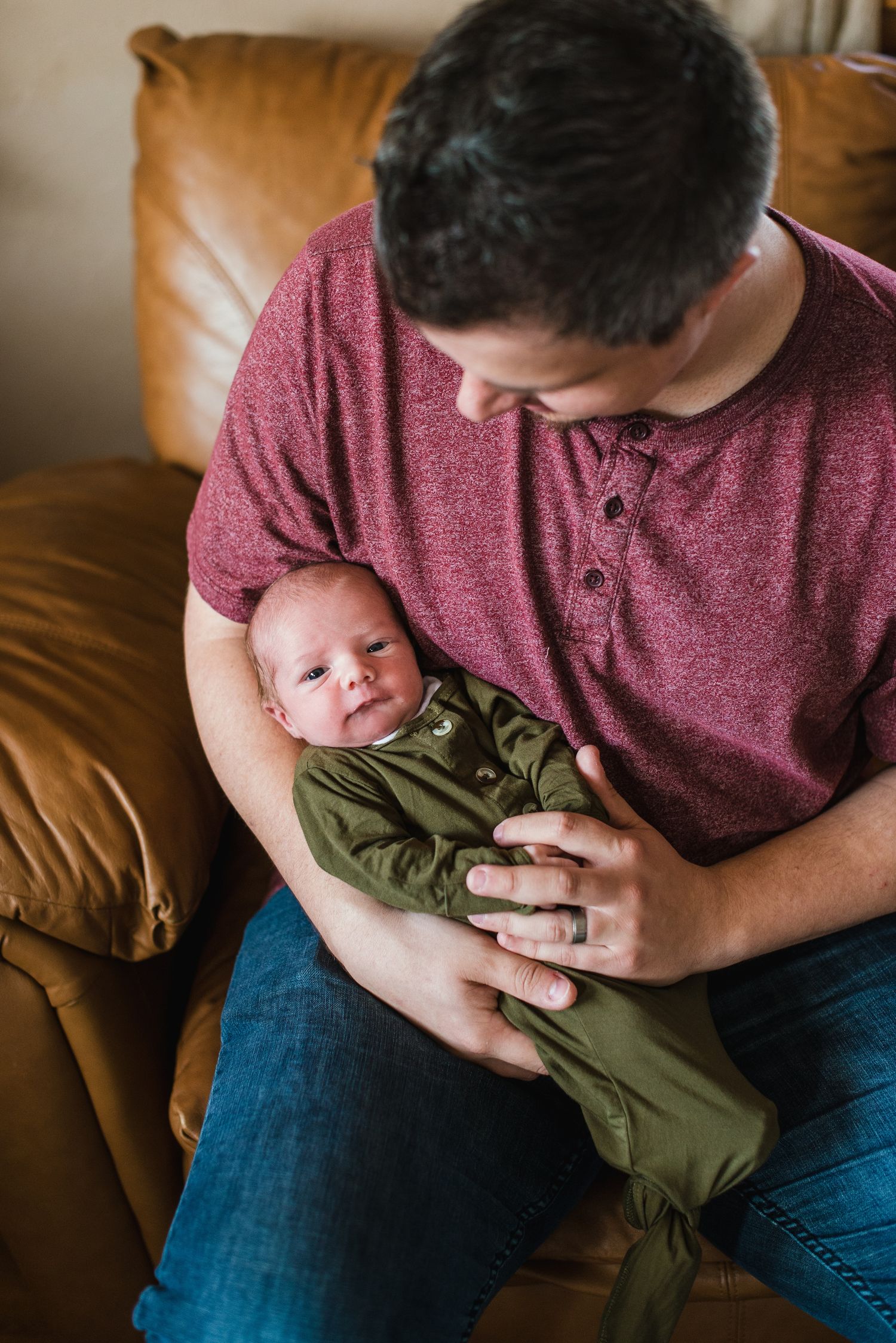 In-home lifestyle newborn family photo session by Wichita photographer