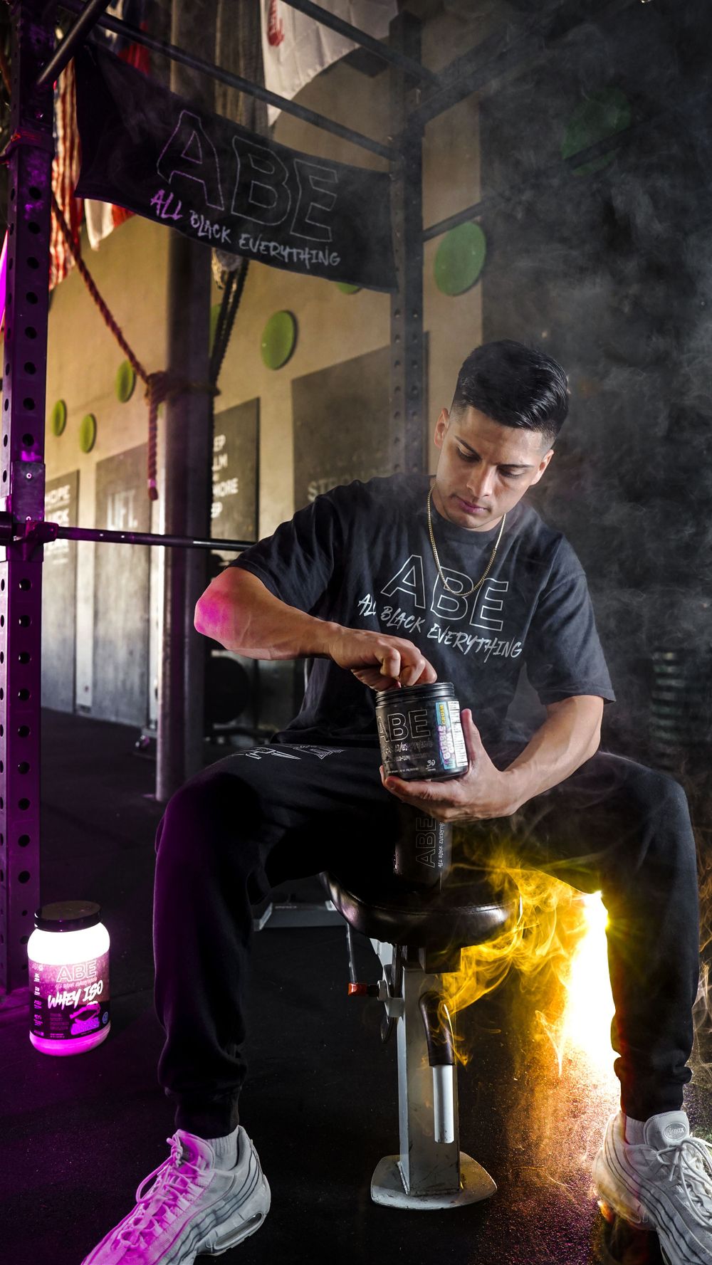 Branden Vasquez promoting ABE supplements in intense gym setting, showcasing fitness lifestyle and high-performance training.